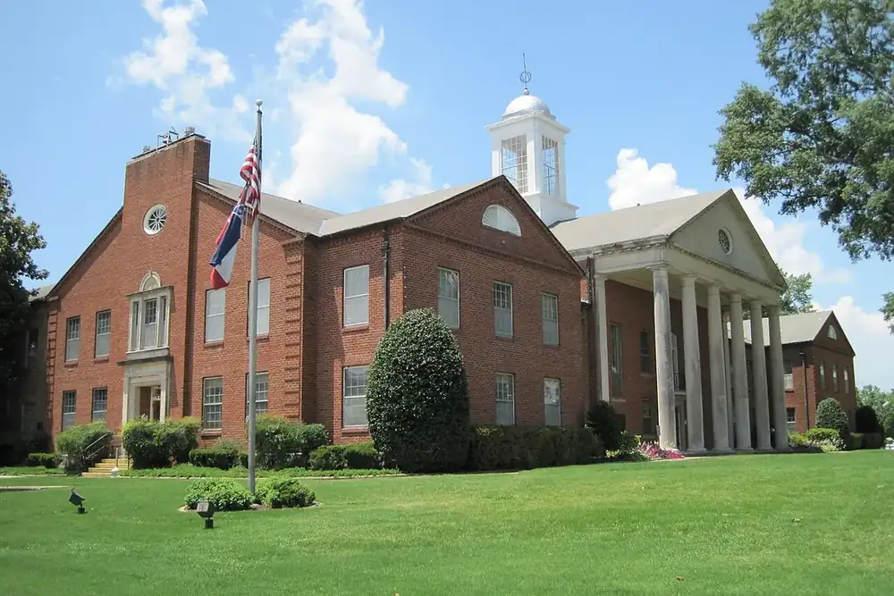 The brick county courthouse with white columns and a cupola in Hernando, Mississippi